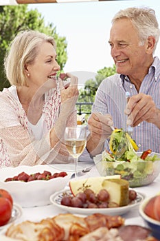 Senior Couple Enjoying Outdoor Meal Together