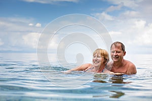 Senior couple enjoying the retirement on a seacost