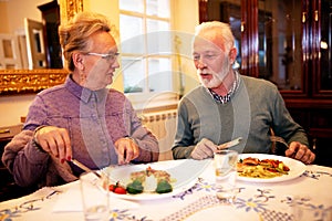 Senior couple enjoying a tasty meal each