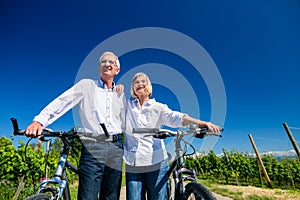 Senior couple enjoying view on bike trip