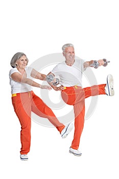 Senior Couple Exercising with dumbbells