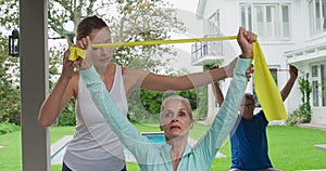 Senior couple exercising in a garden