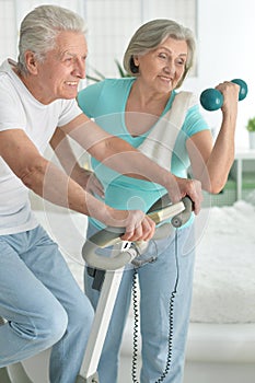 Senior couple exercising in gym