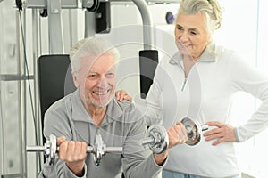 Senior couple exercising in gym