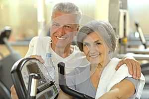 Senior Couple Exercising In gym