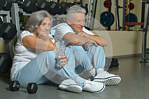 Senior couple exercising in gym