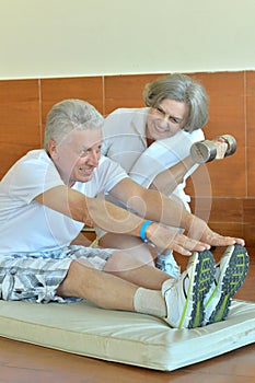 Senior couple exercising in gym