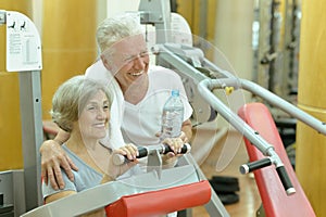 Senior couple exercising in gym