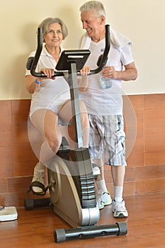 Senior couple exercising in gym