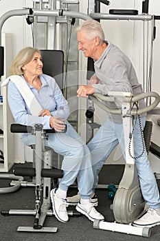 Senior couple exercising in gym