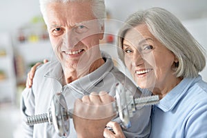 Senior couple exercising in gym