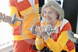 Senior couple exercising in gym