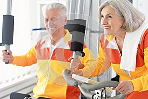 Senior couple exercising in gym