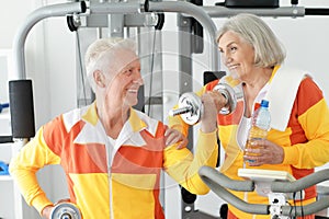 Senior couple exercising in gym