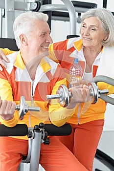 Senior couple exercising in gym