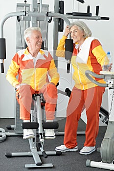 Senior couple exercising in gym