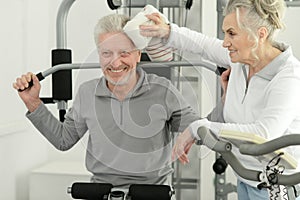 Senior couple exercising in gym together