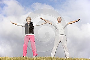 Senior Couple Exercising In The Park