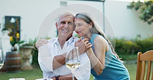 Senior, couple and face outdoor with hug for anniversary date, retirement lunch and bonding in garden. Elderly, man and