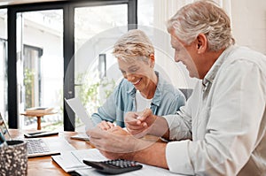 Senior couple, finance and investment or paying their bills at home. Married man and woman use calculator, checking