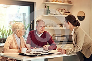 Senior couple, financial advisor and documents for bills, budget or retirement plan in expenses at home. Elderly man and