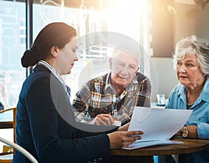 Senior couple, financial advisor and meeting with paperwork in consultation, conversation and retirement plan. Insurance