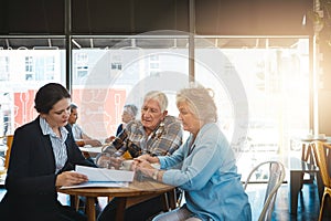 Senior couple, financial consultant and talking in meeting, relax conversation and estate plan for legacy policy photo