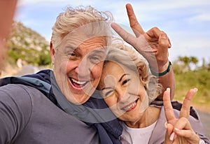 Senior couple, fitness and selfie with peace sign for smile, outdoor and nature for portrait together. Elderly man