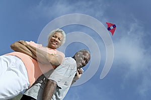 Senior couple flying kite