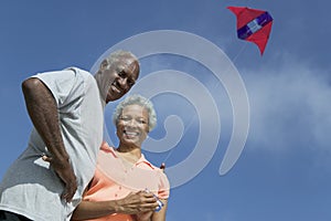 Senior couple flying kite