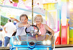Senior couple at the fun fair