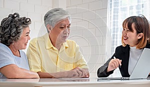 Senior couple get advice from financial planner at home.aging at home