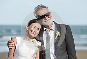 Senior couple getting married at the beach