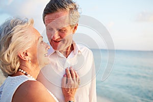 Senior Couple Getting Married In Beach Ceremony