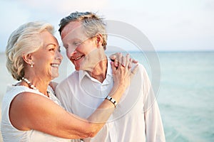 Senior Couple Getting Married In Beach Ceremony