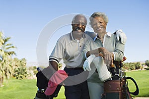 Senior Couple In Golf Course