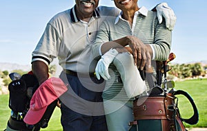 Senior couple golfers in the golf course