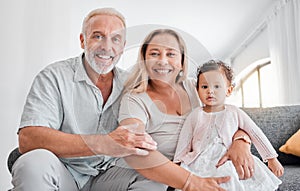 Senior couple, grandparents or baby girl bonding on sofa in house or home living room in trust, babysitting support or