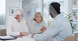 Senior, couple and handshake for financial planning and investment at a meeting. Finance, shaking hands and agreement