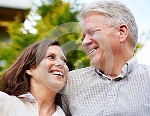 Senior couple, happy and smiling in outdoor, marriage and embrace, laugh and retired. Retirement, elderly and love for