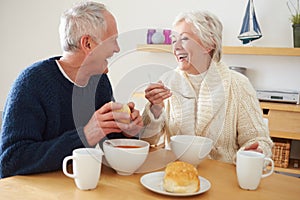 Senior Couple Having Bowl Of Soup For Lunch