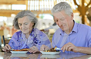 Senior couple having breakfast