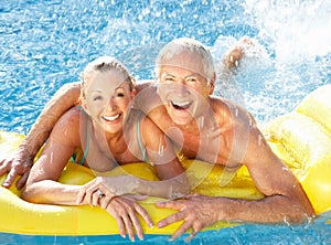 Senior couple having fun in pool