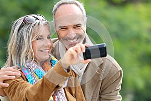 Senior couple having fun taking picture