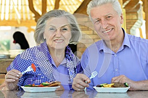 Senior couple having lunch