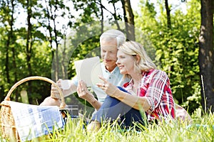 Senior couple having picnic