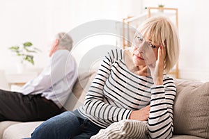 Senior Couple Having Relationship Problems, Looking To Opposite Sides