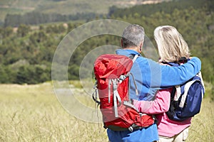 Senior Couple On Hike Through Beautiful Countryside