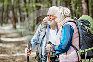 Senior couple hiking in the forest