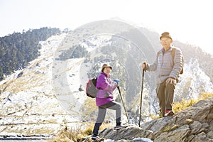 Senior couple hiking on the mountain